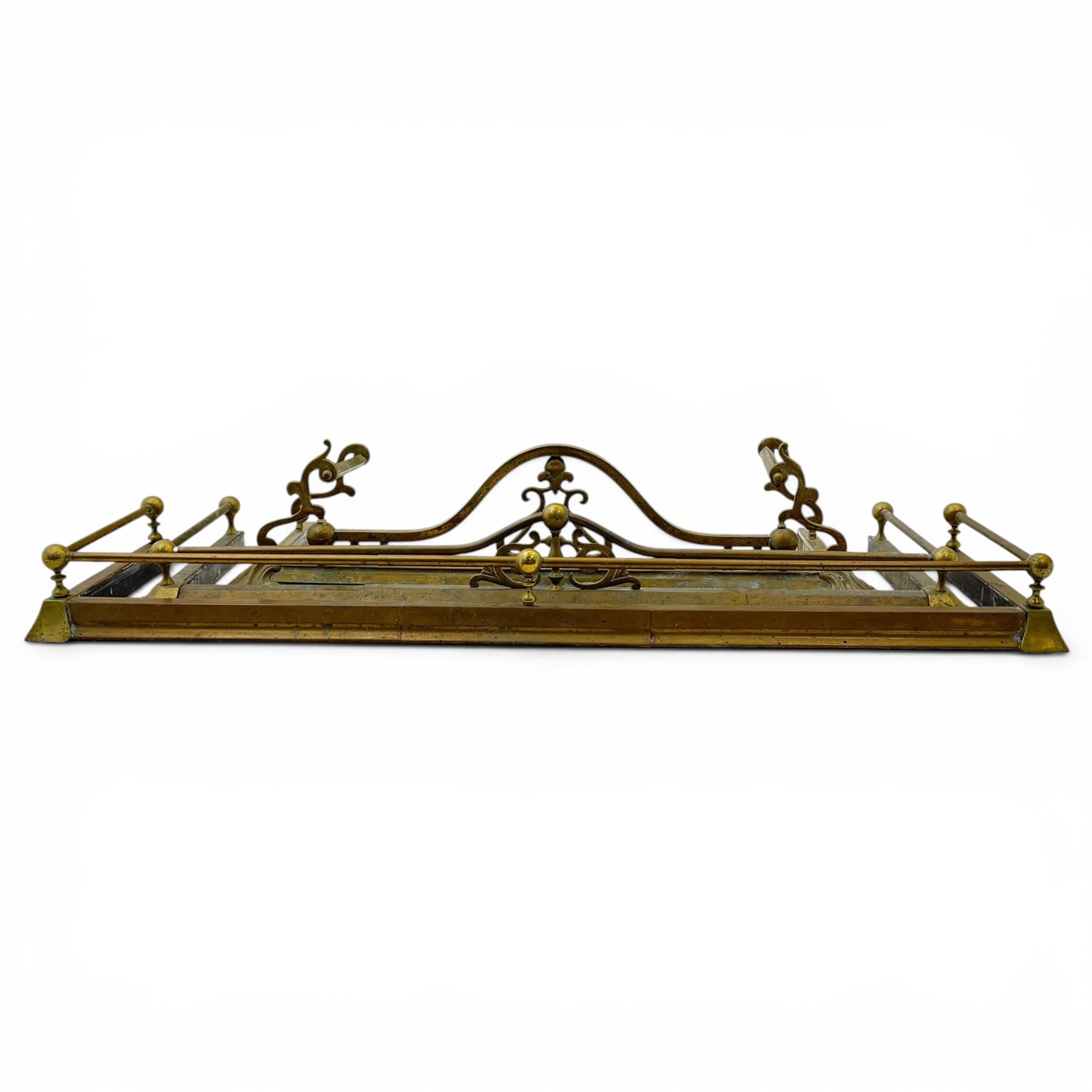 Three 20th century brass fenders, two with pierced Art & Crafts design rails, largest W156cm, D 45cm 