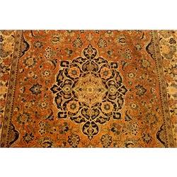  Persian multicoloured rug, floral field within repeating scroll border, 215cm x 134cm,   