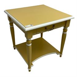 Pair of side lamp tables, square ovolo-moulded top over single drawer, on turned supports united by under-tier, in deep yellow and cream paint finish 