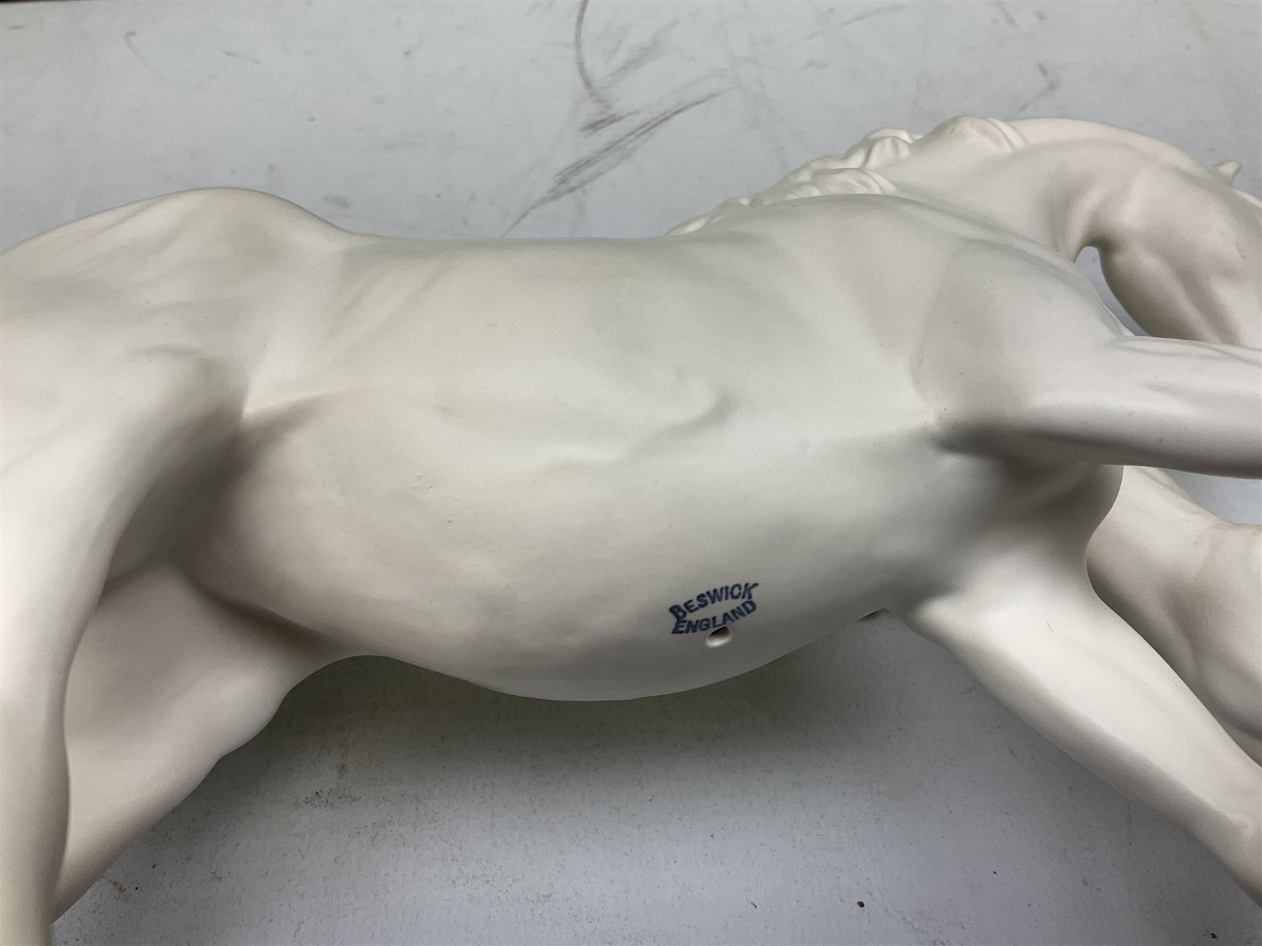 Five Beswick and Royal Doulton horse figures in matt white on black plinths, comprising of  Spirit of Affection no. 2689/2536, Springtime no.2837, Spirit of peace no.2916, Spirit of earth no.2914 and Spirit of the wild no. 183, together with a composite figure of a horse (6)