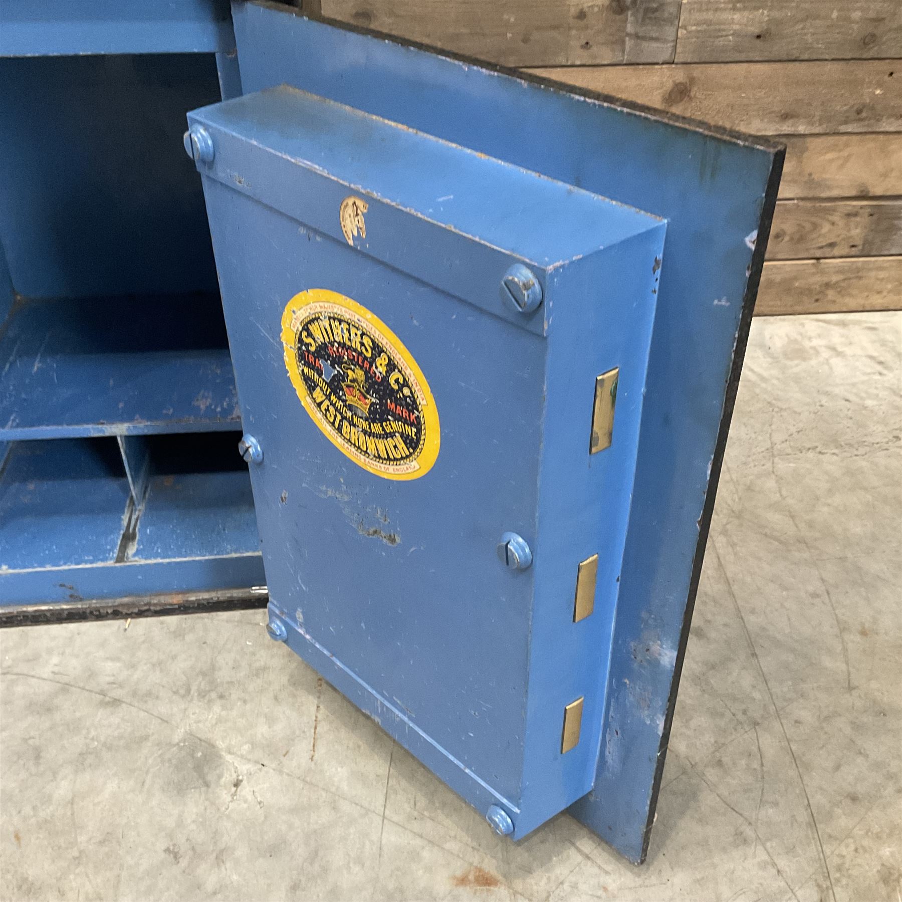 Samuel Withers & Co of West Bromwich - Victorian cast iron safe, the brass handle modelled as a clenched fist, painted in red, orange and black, with key. Ground floor delivery only, no steps.