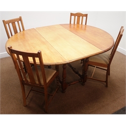  Early 20th century light oak drop leaf table, gate leg action, turned supports (137cm x 175cm, H75cm) and four oak chairs with upholstered seats  