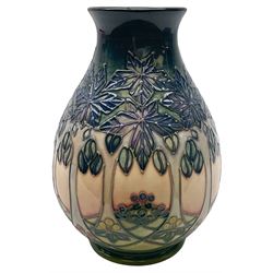 Moorcroft vase, of baluster form, decorated in the Cluny pattern designed by Sally Tuffin, with impressed and painted marks beneath, including date symbol for 1992, H19cm, with maker's box. 
