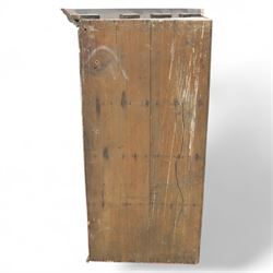 19th century oak wall hanging corner cupboard, moulded cornice above a panelled door enclosing shaped interior shelves, finished in green paint to the backboards