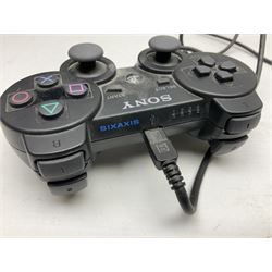 Sony PlayStation 3 60GB console with one PS3 controller, two PS2 controllers, BD remote control, PSP handheld gaming console with case, GAMEware PSP essentials pack, and a selection of PS2, PS3 and PSP games in original cases with instruction booklets 
