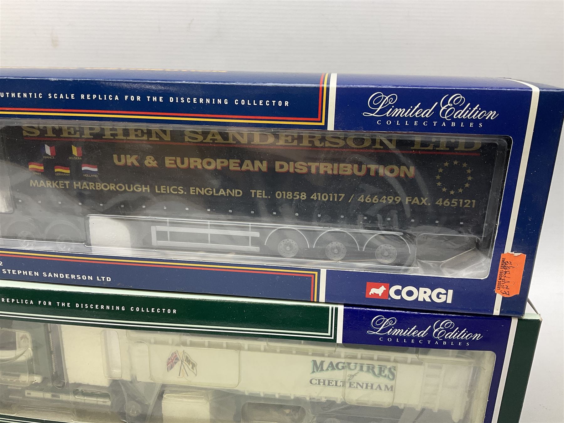 Three Corgi 1:50 scale lorries - ERF Tanker - Gulf Oil in perspex display case No.75101; limited edition Scania T Bulk Tipper - Maguires of Cheltenham No.CC12803; and Scania Topline Curtainside - Stephen Sanderson Limited No.CC12912; all boxed (3)