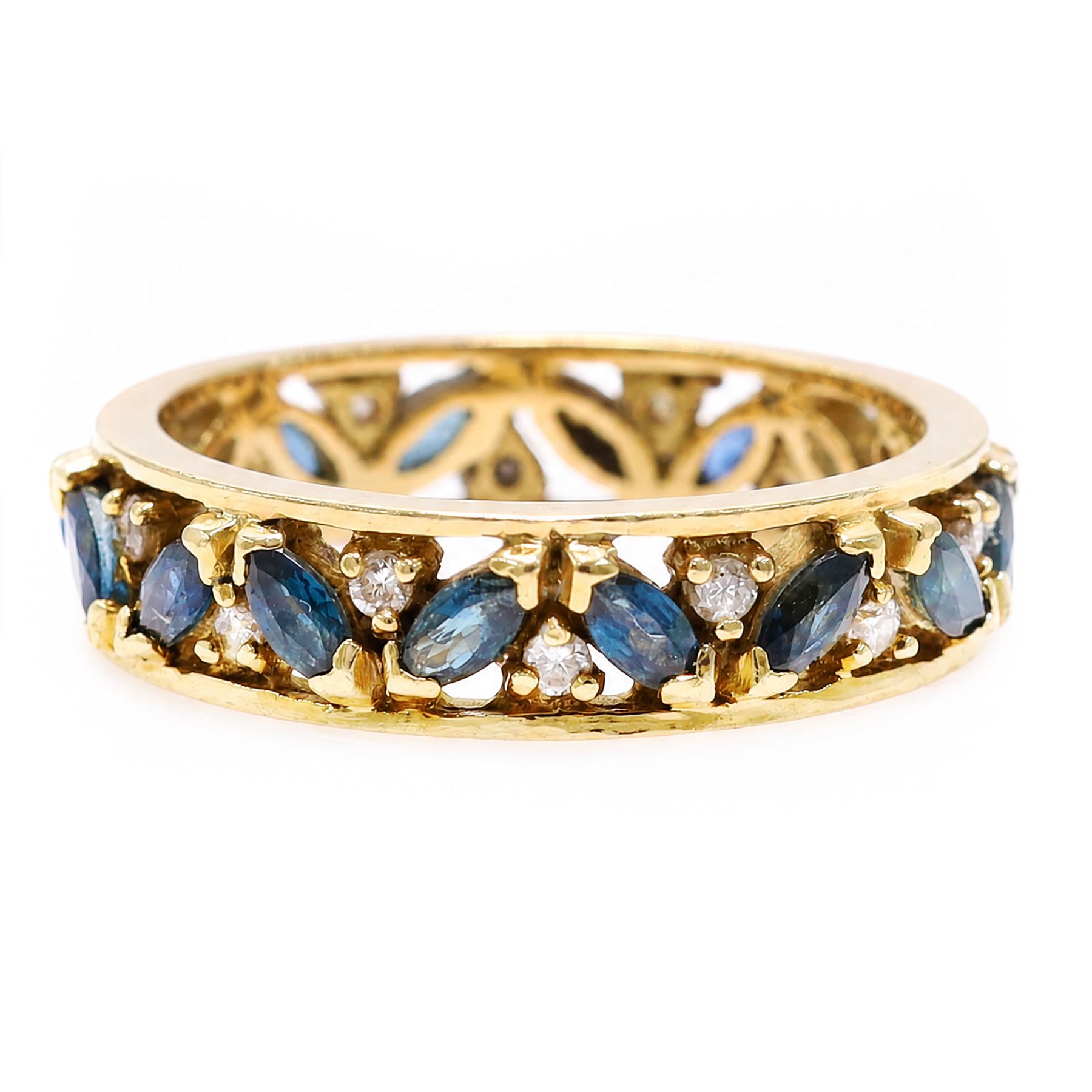 18ct gold sapphire and diamond full eternity ring, sixteen marquise cut sapphires, each spaced by a round brilliant cut diamond, London import mark 1992