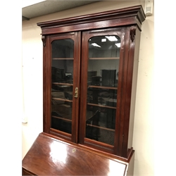  19th century mahogany bureau with bookcase top, two doors, fours shelves above fall front with fitted interior, four graduation drawers, turned supports, W104cm, H233cm, D51cm  