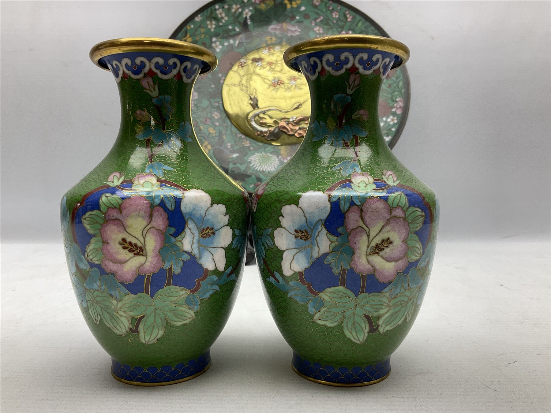 Cloisonné plate decorated with birds and flowers, together with a pair of Cloisonné vases of baluster form 
