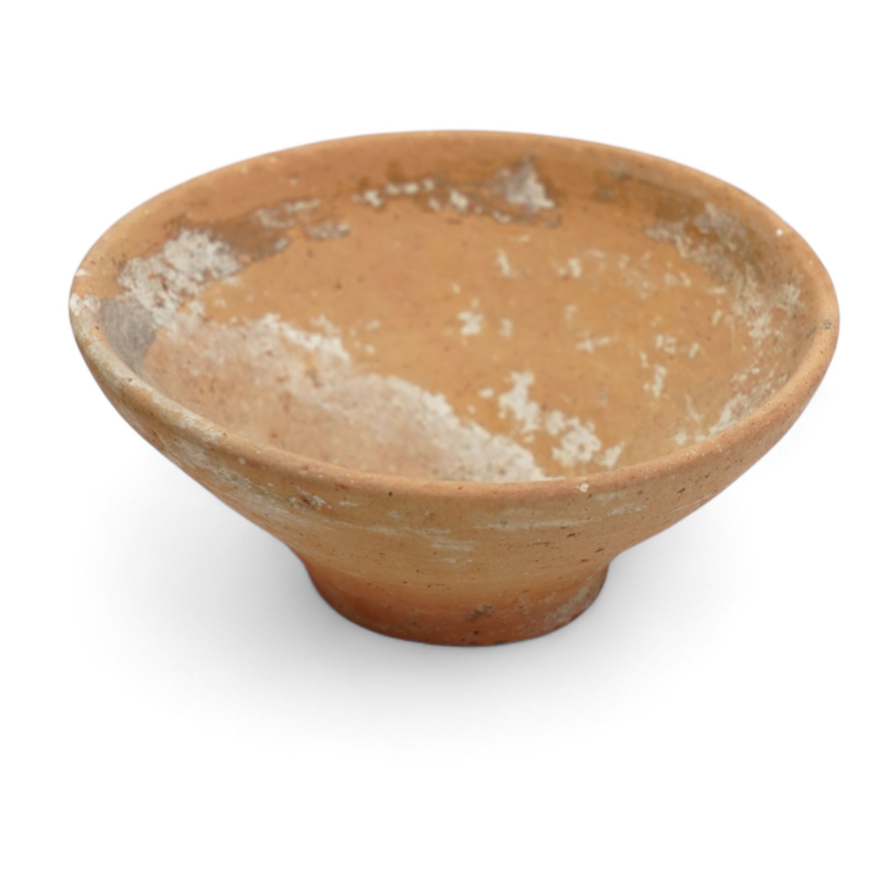 A group of eight ancient terracotta vessels - Near East and Eastern Mediterranean c.2nd millennium BC-1st century AD, comprising a Nabataean red terracotta ‘eggshell’ bowl (c.1st century BC-1st century AD) finely wheel-made with a thin-walled hemispherical form and pale red slip; a Near Eastern black-burnished spouted vessel (c.1800-1600 BC) of globular form with single handle and short spout; large Roman or Late Iron Age single-handled jug (c.1st century BC-1st century AD) wheel-made with a wide neck and ovoid body; together with five further vessels including shallow dishes, squat jars and a ribbed bottle, likely of Middle Bronze Age Levantine and Roman provincial types.
Provenance: By the vendor’s repute, acquired/collected in the Middle East (Dead Sea area/Syria) in the 1960s