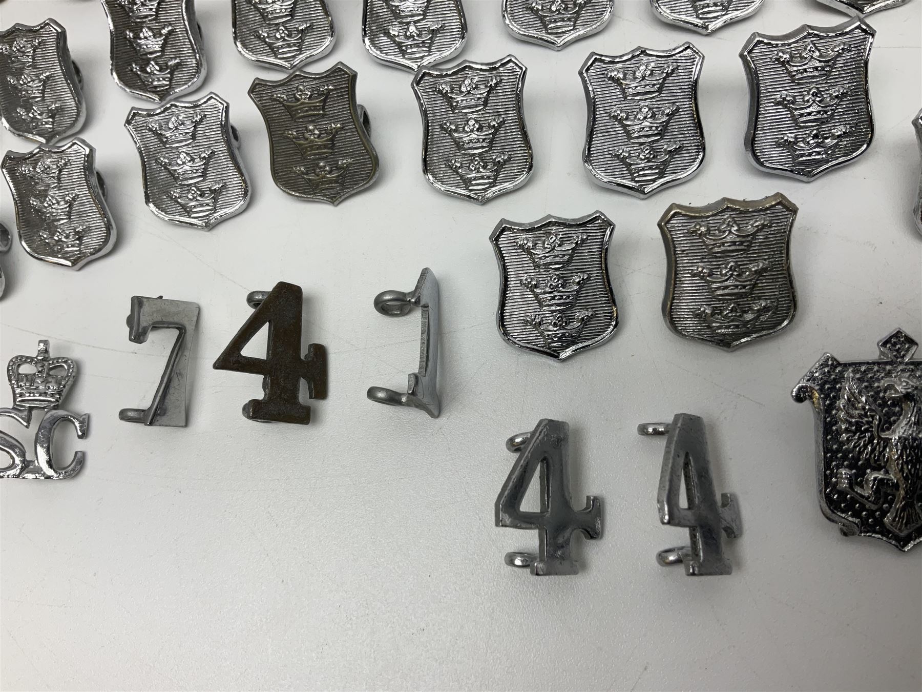 Police - large quantity of cap and collar badges, collar numbers and buttons for Hull City Police, Humberside Police, Lincolnshire Constabulary, York & North East Yorks Police etc; all queen's crown; and three helmet plates including one king's crown