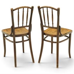 Thonet - pair of early 20th century bentwood bistro side chairs, spindle backs over anthemion motif seats, on tapering supports