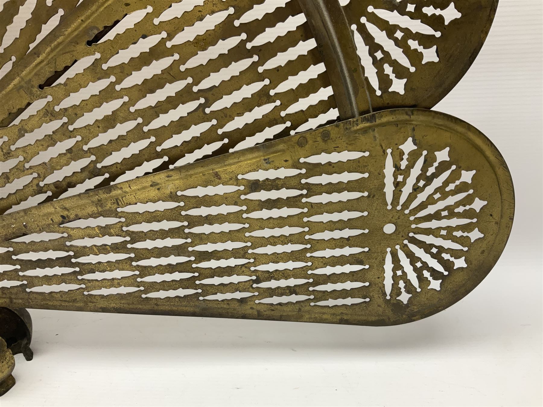 Pierced brass peacock style folding fire screen, with urn finial, H65.5cm