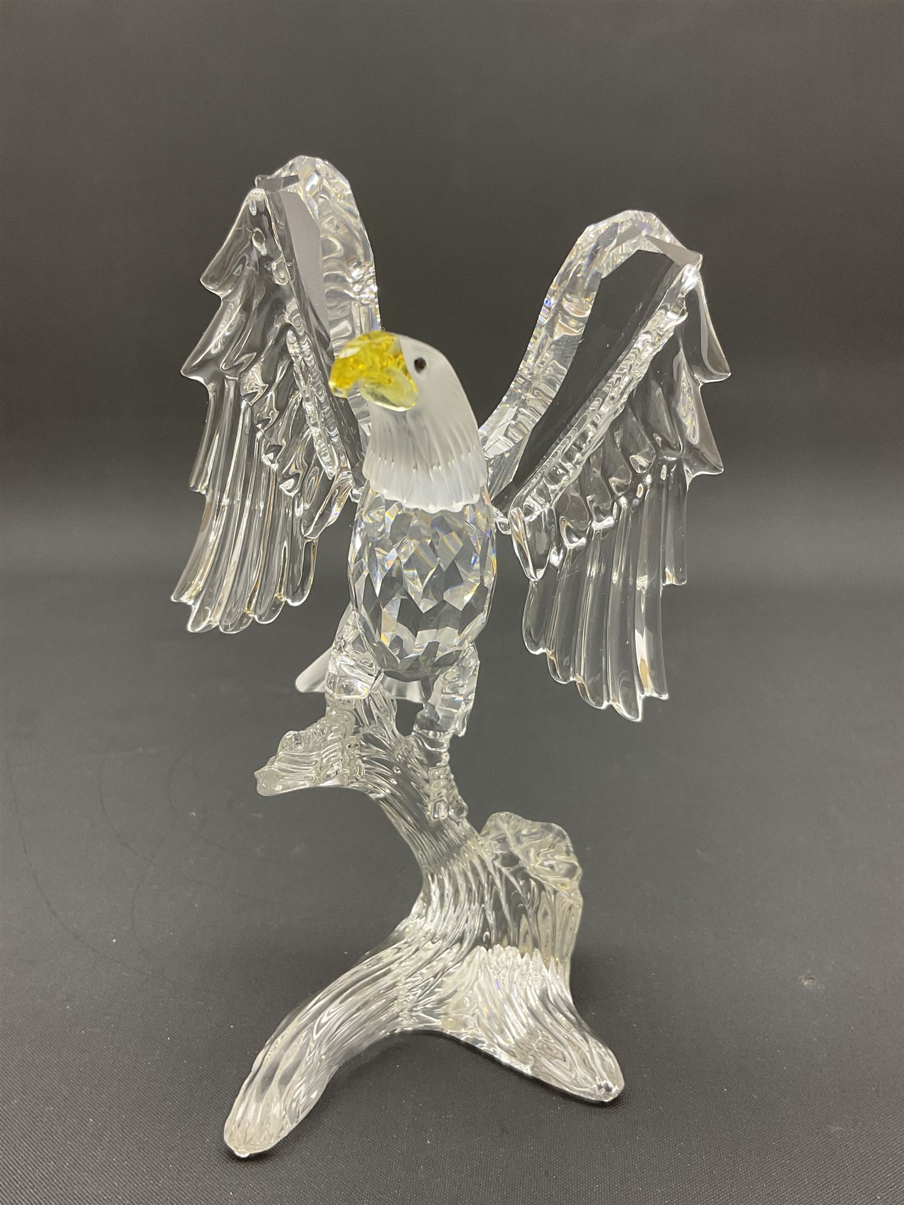 Swarovski Crystal animals, comprising white peacock, the tail with cascading blue flowers, perched eagle with yellow beak, ibex with frosted crystal horns and unicorn with frosted crystal horn, tallest H13cm