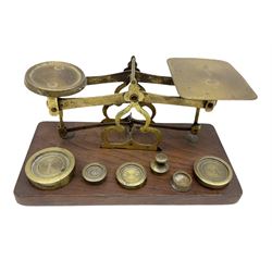 Brass postage scales on rectangular wooden base, together with weights, H9.5cm, L18.5cm
