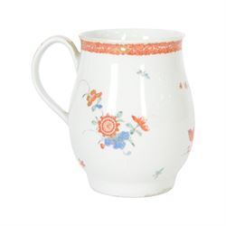 Mid 18th century Worcester mug, circa 1756-1758, of bell form with grooved loop handle, decorated in the Two Quail pattern in the Kakiemon palette with two birds and blossoming prunus trees amongst further flowers, sprigs and insects, bellow an iron red foliate border to rim, H12cm
