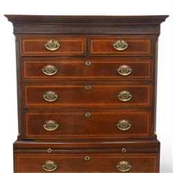  Late 18th century mahogany and inlaid chest on chest, projecting cornice above blind fretwork in laid drawers, the upper chest with two short over three graduating drawers, the lower section with brushing slide over three long graduated drawers, raised on bracket feet