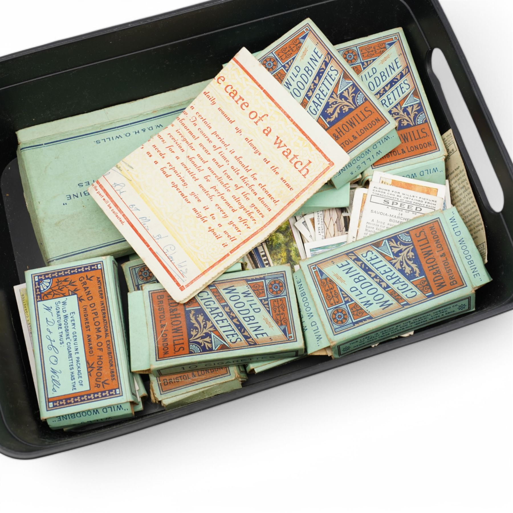 Large collection of cigarette cards, comprising approximately seventeen albums including RAF badges, Association Footballers 1935-1936, Air Raid Precautions, Motor Cars, and various other 'Wild Woodbine' boxes 