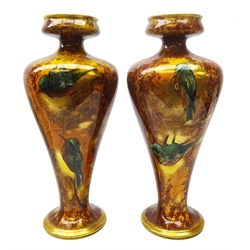  Pair Thomas Forester & Sons pottery vases designed by R Dean, painted with birds in a woodland setting, H41cm   