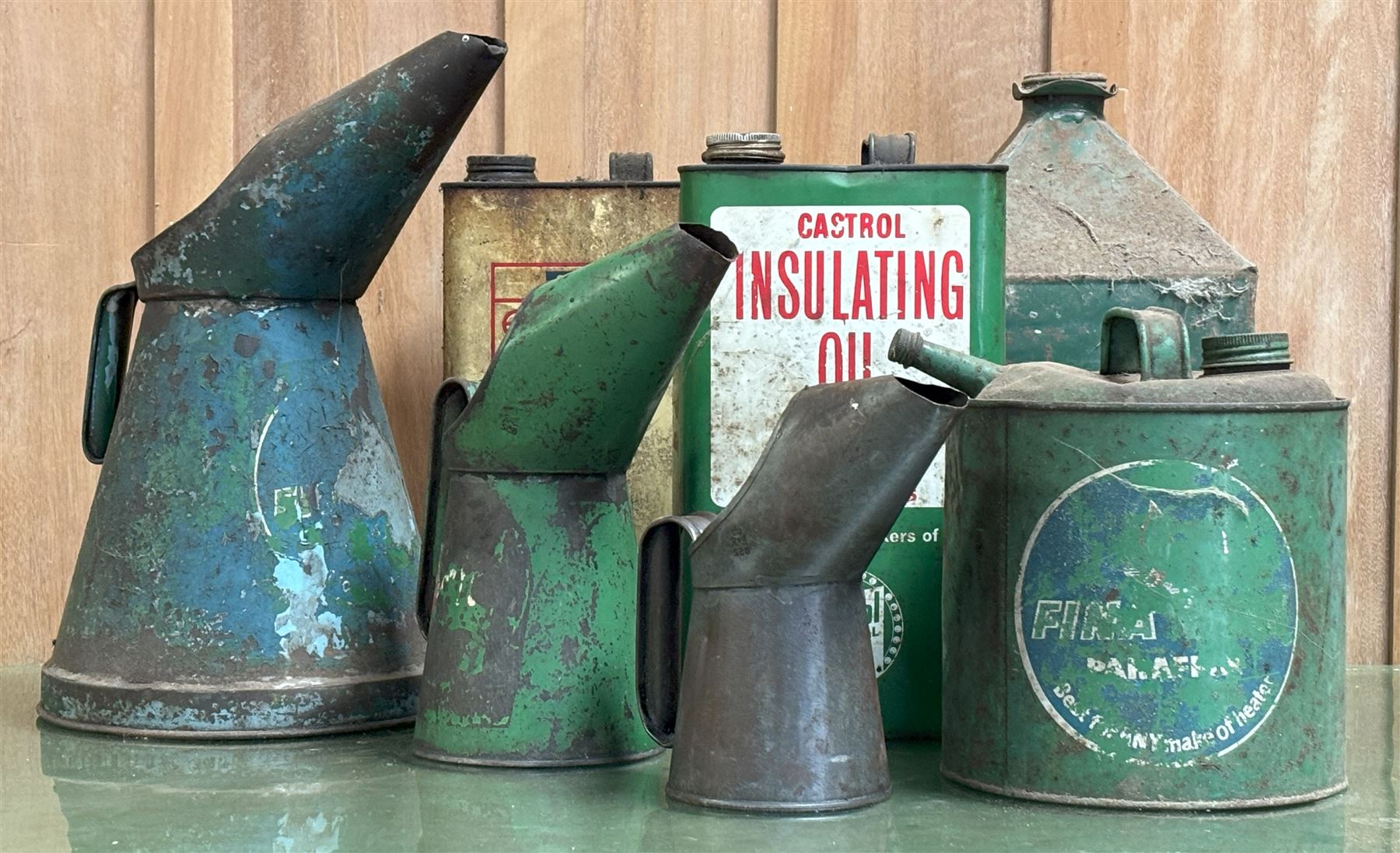 Group of vintage oil tins, to include Ensign motor oil, Castrol insulating oil, Fina Green gallon pourer, Fina Green paraffin tin, etc. (7) - COLLECTION BY APPOINTMENT FROM: The White House, Thirsk Road, Easingwold, York, YO61 3NF - CALL 01723 507111 TO ARRANGE