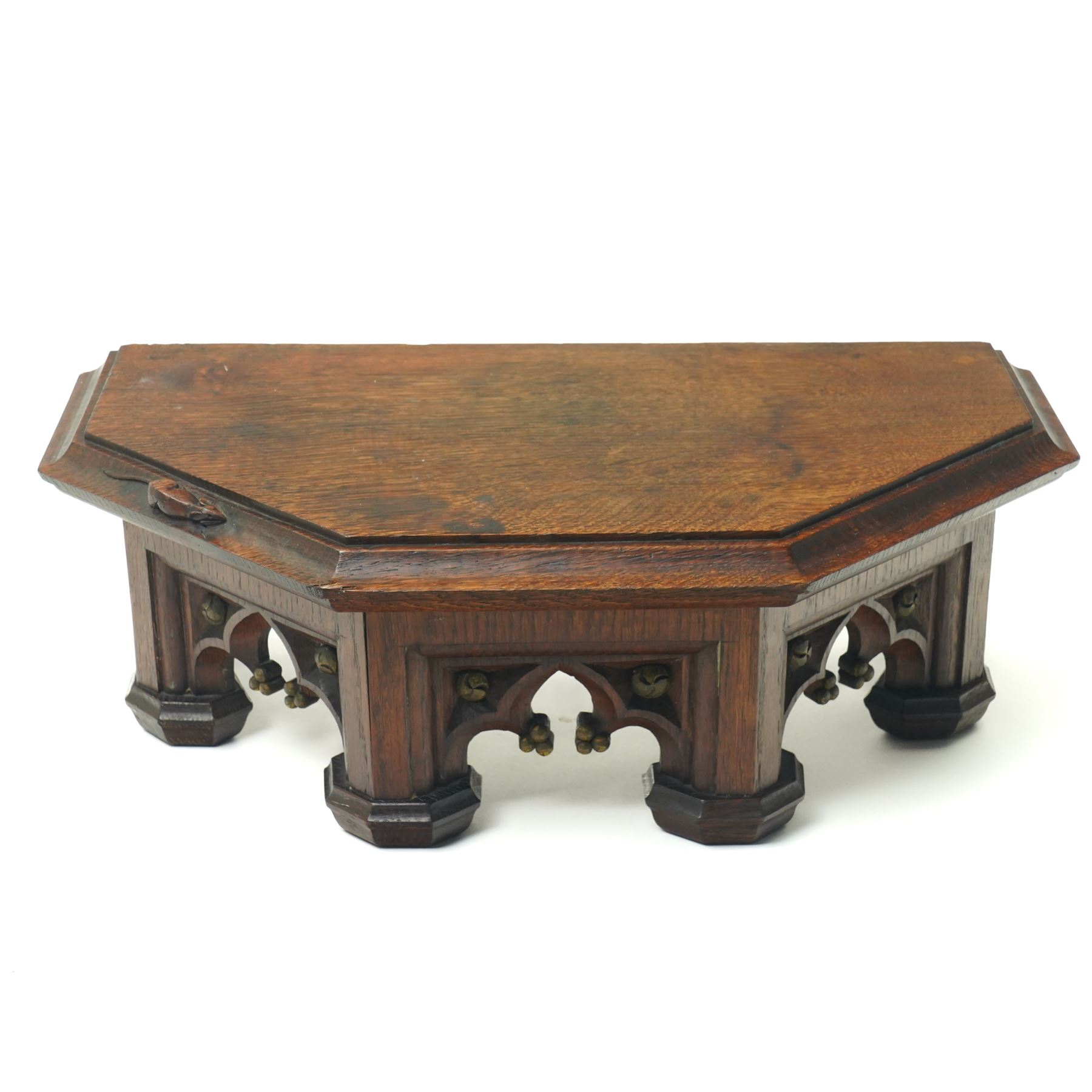 Mouseman - circa 1930s oak wedge shaped six sided plinth, of gothic design with carved berries and columnar supports, with carved mouse signature, by Robert Thompson of Kilburn