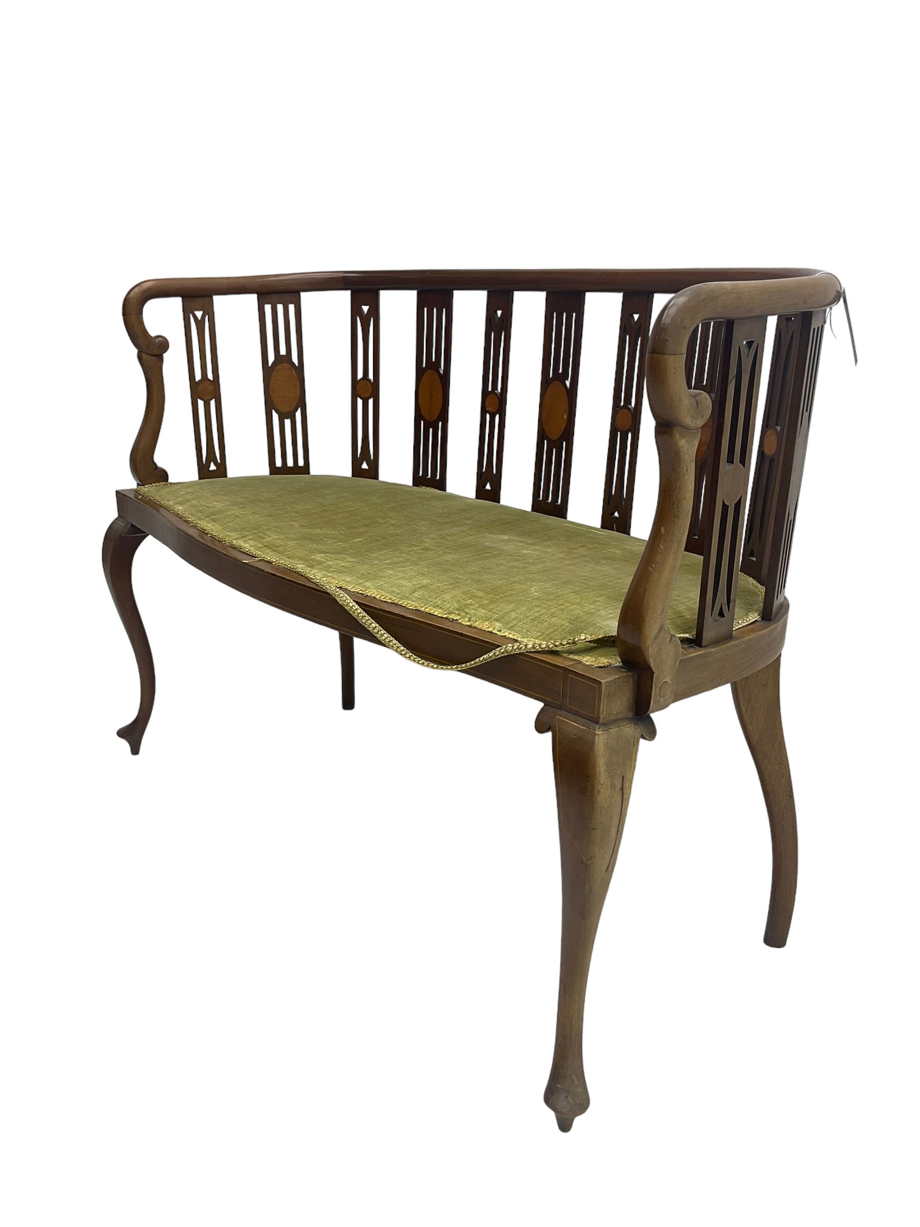 Edwardian inlaid mahogany salon settee or bench, the pierced and inlaid splat back over serpentine front, seat upholstered in laurel green velvet, raised on cabriole supports with satinwood stringing