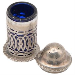 Late Victorian silver three piece cruet set, comprising open salt, pepper pot and mustard pot with cover, all with pierced decoration and upon four bun feet, hallmarked John Charles Lowe, London 1899 and 1900, salt with different maker's mark worn and indistinct, all with blue glass liners