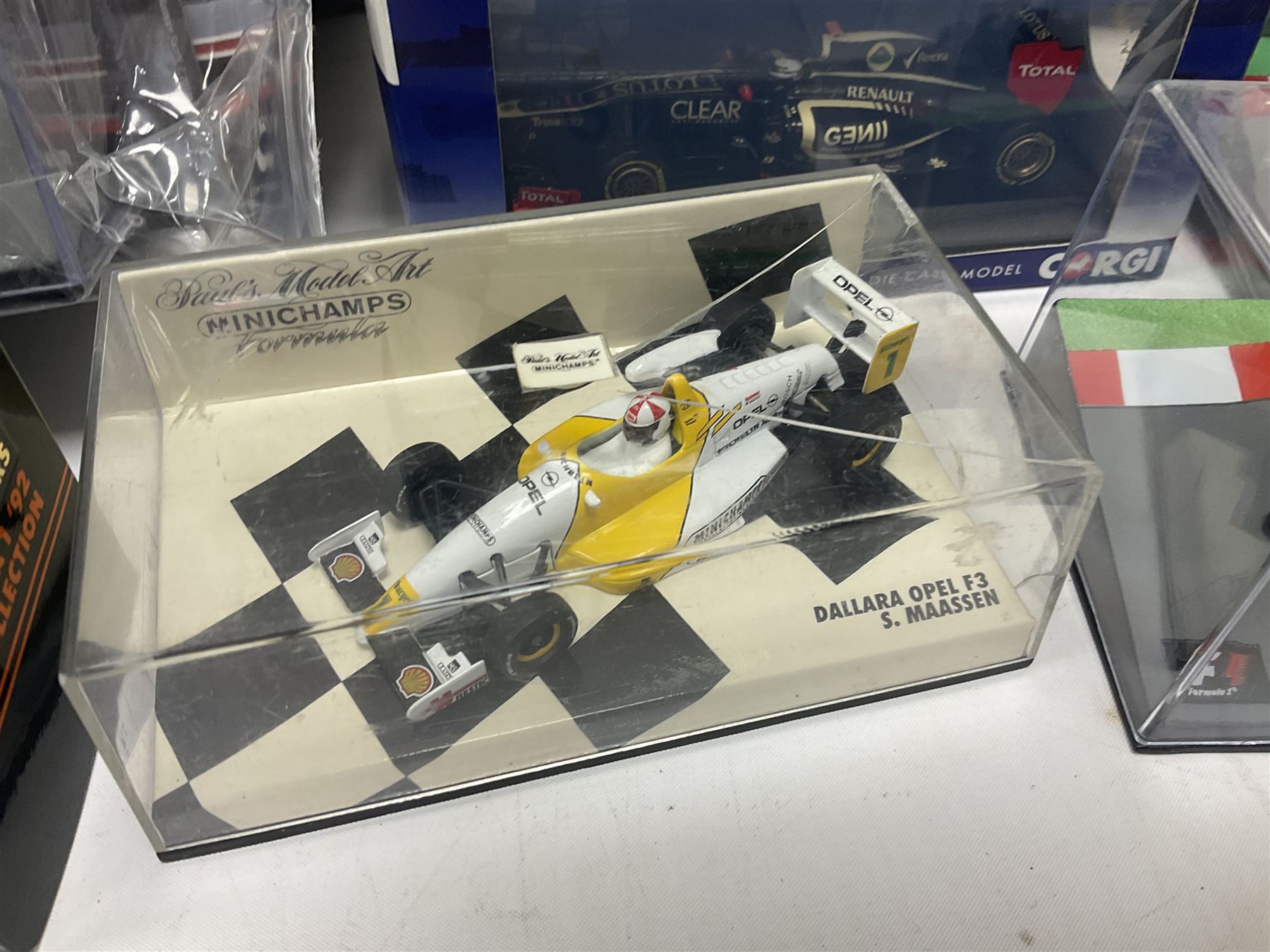 Panini Formula 1 The Car Collection - twelve die-cast models including ten in unopened packaging with periodical; all models in plastic display boxes; and eight other boxed die-cast models of racing cars by Corgi, Onyx, Classico, Minichamps etc (20)