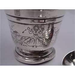 1930's silver christening mug, of tapering cylindrical form with engraved initials to the stepped rim, the lower section of the body engraved with a vignette of Little Miss Muffet, and angular handle, upon a circular stepped foot, hallmarked Birmingham 1934, makers mark worn and indistinct, together with a 1930's silver napkin ring, of oval form with engine turned decoration, hallmarked Joseph Gloster Ltd, Birmingham 1934, an early 20th century silver napkin ring, of circular form with foliate engraved decoration, hallmarked Francis Webb, Birmingham 1919, and two mid/late 20th century silver spoons, approximate total silver weight 5.76 ozt (179.3 grams)