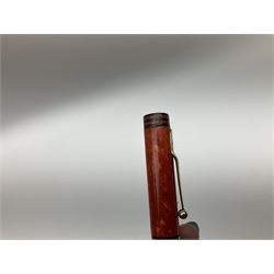 Vintage Swan Mabie Todd lever fill fountain pen in coral red, the nib a/f marked 14K, together with two further vintage Swan Mabie Todd fountain pens, the first example with lever fill, the other leverless, each with black body, one with nib marked 14ct, (3) 