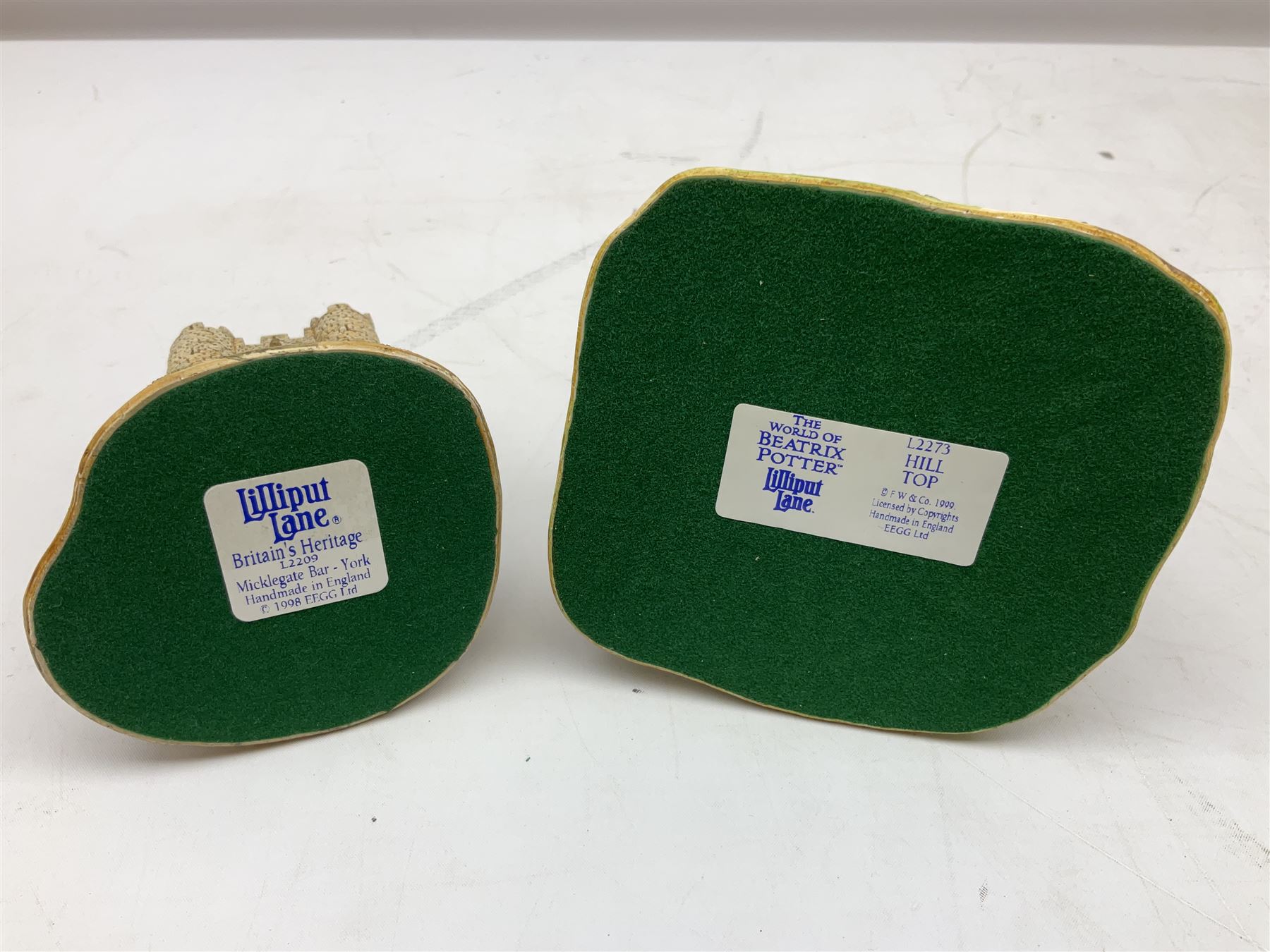 Four Lilliput Lane models from the 'Britain's Heritage' collection, comprising Edinburgh Castle, The World Famous Blacksmith's Shop Gretna Green, Shakespeare's Birthplace and Mickelgate Bar York, together with  a Lilliput Lane Beatrix Potter Hill Top model, all boxed