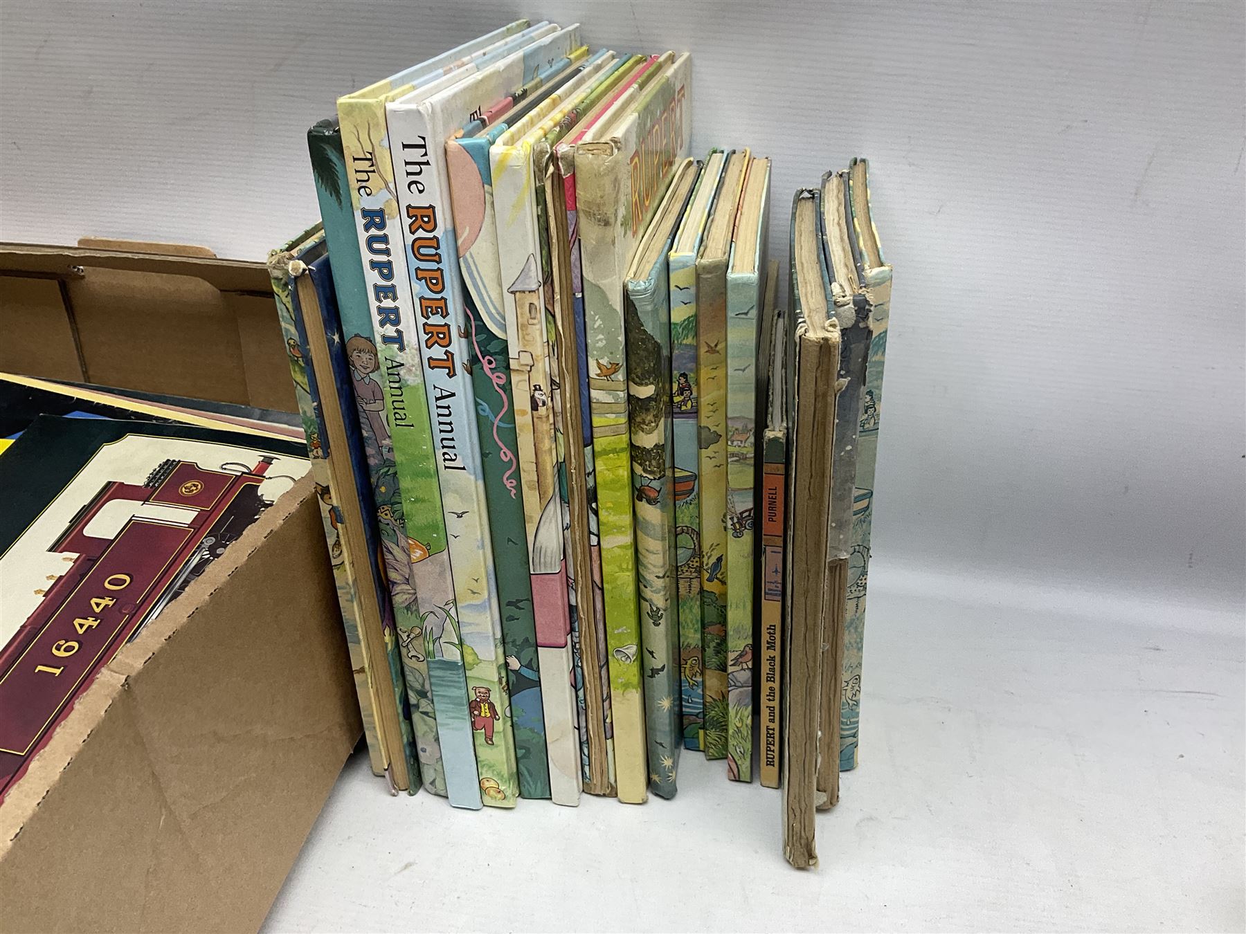 Collection of Rupert Bear annuals together with, two Corgi models, postcards and other ephemera 