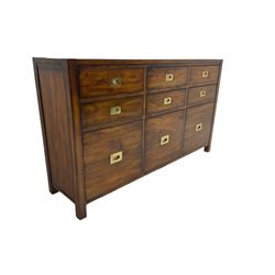 Cherrywood military style sideboard chest, fitted with nine drawers with recessed brass handles