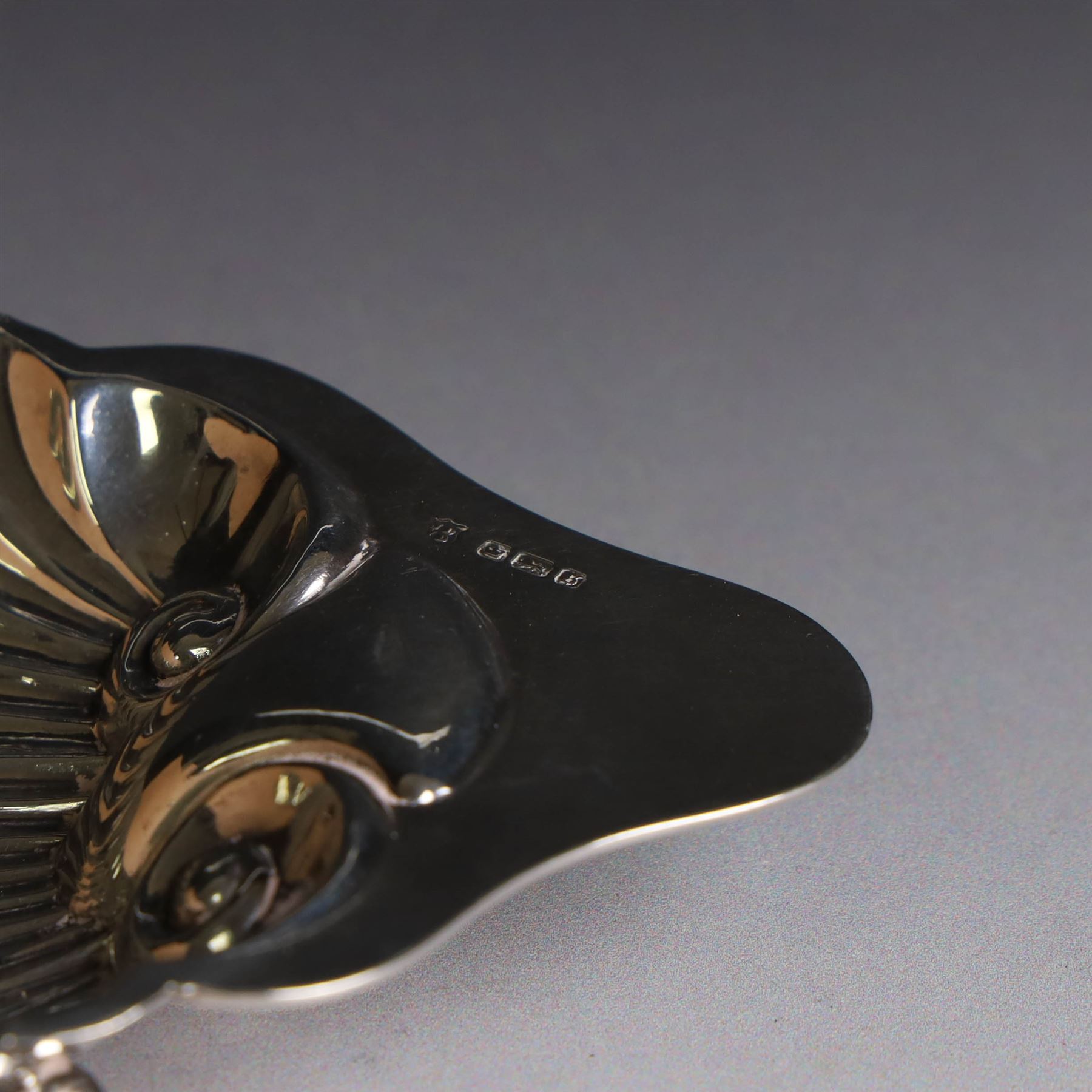 Edwardian silver clam shell butter dish, upon three bun feet, hallmarked James Deakin & Sons, Sheffield 1910