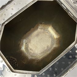 Victorian silver four piece tea service, comprising teapot, teapot stand, twin handled open sucrier and milk jug, each of octagonal form with foliate bud border and engraved decoration including crest to canted panels, and vacant panels, the teapot with ivory finial to the hinged cover and later wooden handle, hallmarked Edward Barnard & Sons Ltd, London1896, teapot including finial H15cm, milk jug including handle H16cm, teapot stand W11.5cm

This item has been registered for sale under Section 10 of the APHA Ivory Act