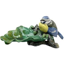Minton majolica leaf dish, modelled as a Blue Tit perched on a branch with acorns and an oak leaf, date cypher for 1868, impressed marks beneath, L21cm. 