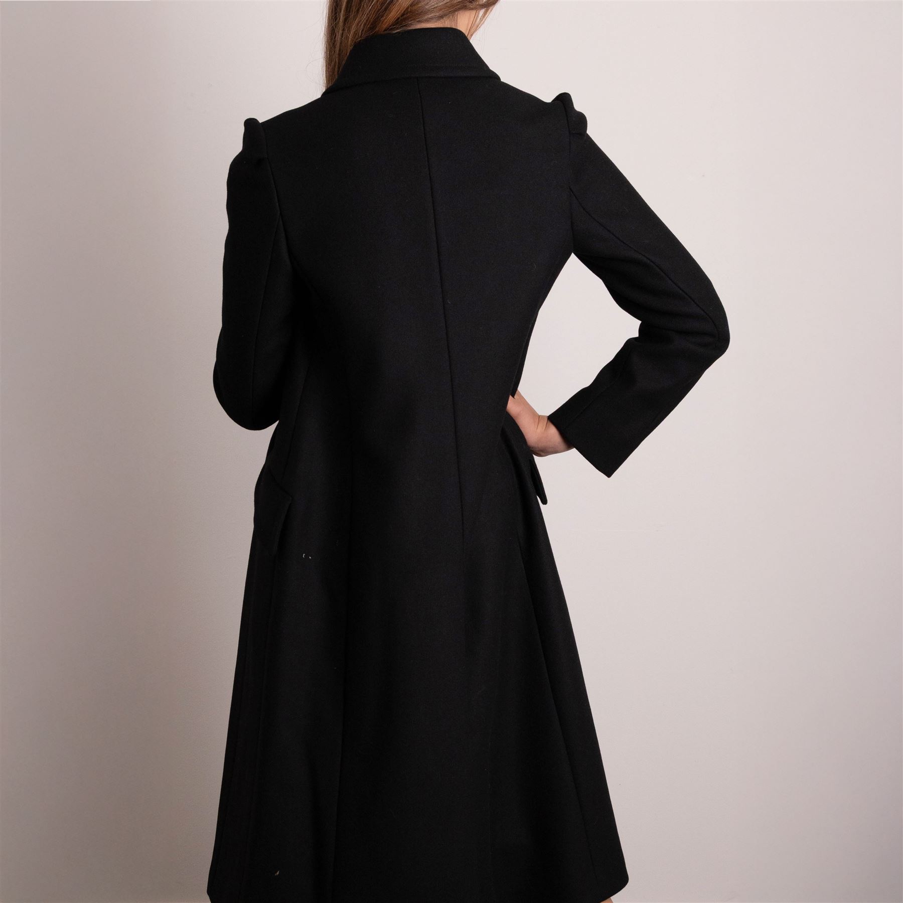 Prada - black Melton wool coat, in a redingote style with front fastening and fabric-covered buttons, flap pockets and a structured collar with slit to the back, size 44, unused with the original garment bag and hanger