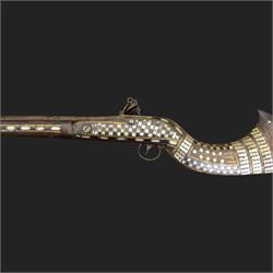 Indian Jezail style flintlock musket, with 118cm barrel, the East India Company lock marked 1818,  the curved butt inlaid with mother of pearl and brass decoration, overall L155cm