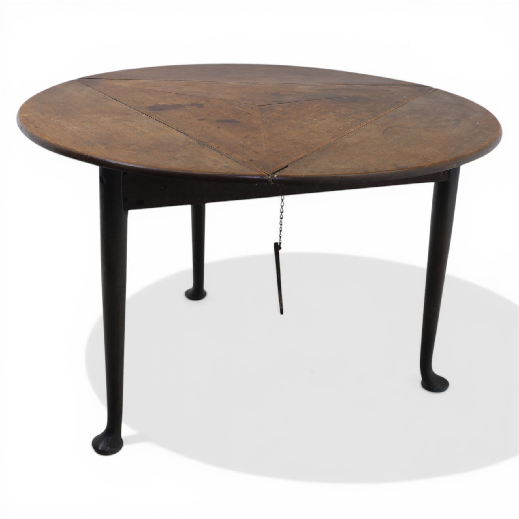 18th century oak folding cricket table, triangular top with three hinged demi-lune leaves, raised on tapering supports with pad feet