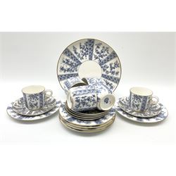 A late 19th century Royal Worcester tea set for six, comprising teacups, saucers, side plates and cake plate, decorated with foliate panels in blue upon a white ground, with printed marks beneath, a number of pieces also numbered W3232. 