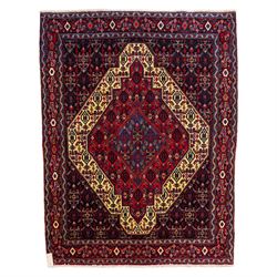 North West Persian Senneh hand-knotted rug, dark indigo field with a central bold stepped ...