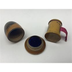 Six sewing related Mauchline ware comprising an oval reel box with internal label for Clark & Co's, tape measure, pin case and three thimble holders of ovoid form 