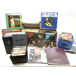  A large quantity of assorted vinyl records, to include examples by The Beatles, Tom Jones, The Carpenters, Johnny Cash, and other LP's and 45 RPM's.   