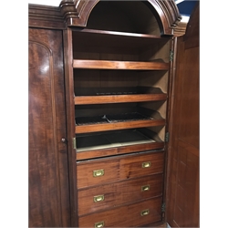 Victorian mahogany triple breakfront wardrobe with arched top, projecting cornice, three doors with single full length mirror enclosing four linen slides and five drawers, plinth base, W220cm, H231cm, D75cm  