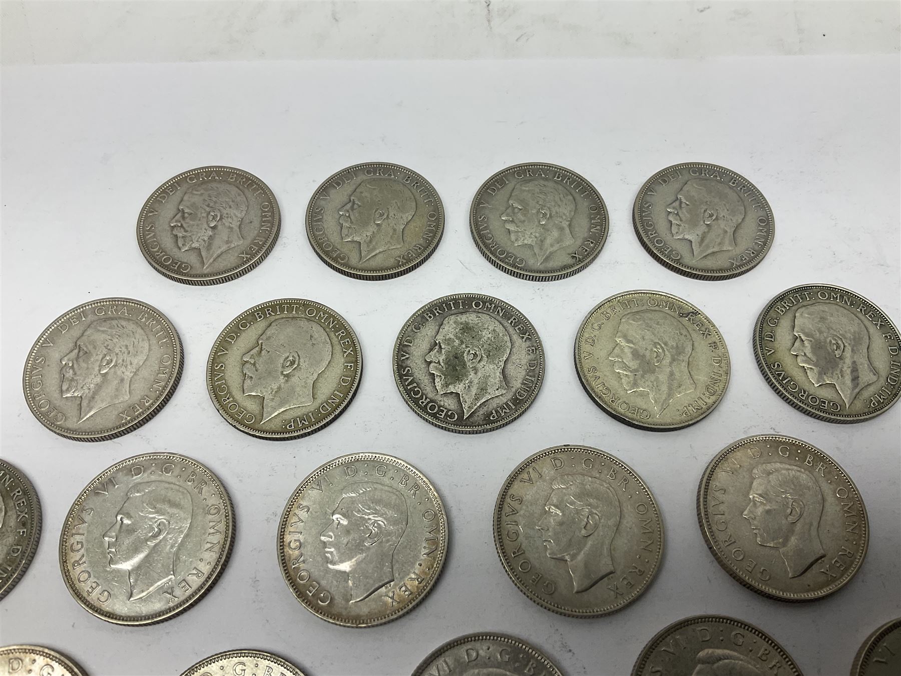 Approximately 260 grams of Great British pre 1947 silver two shillings coins 