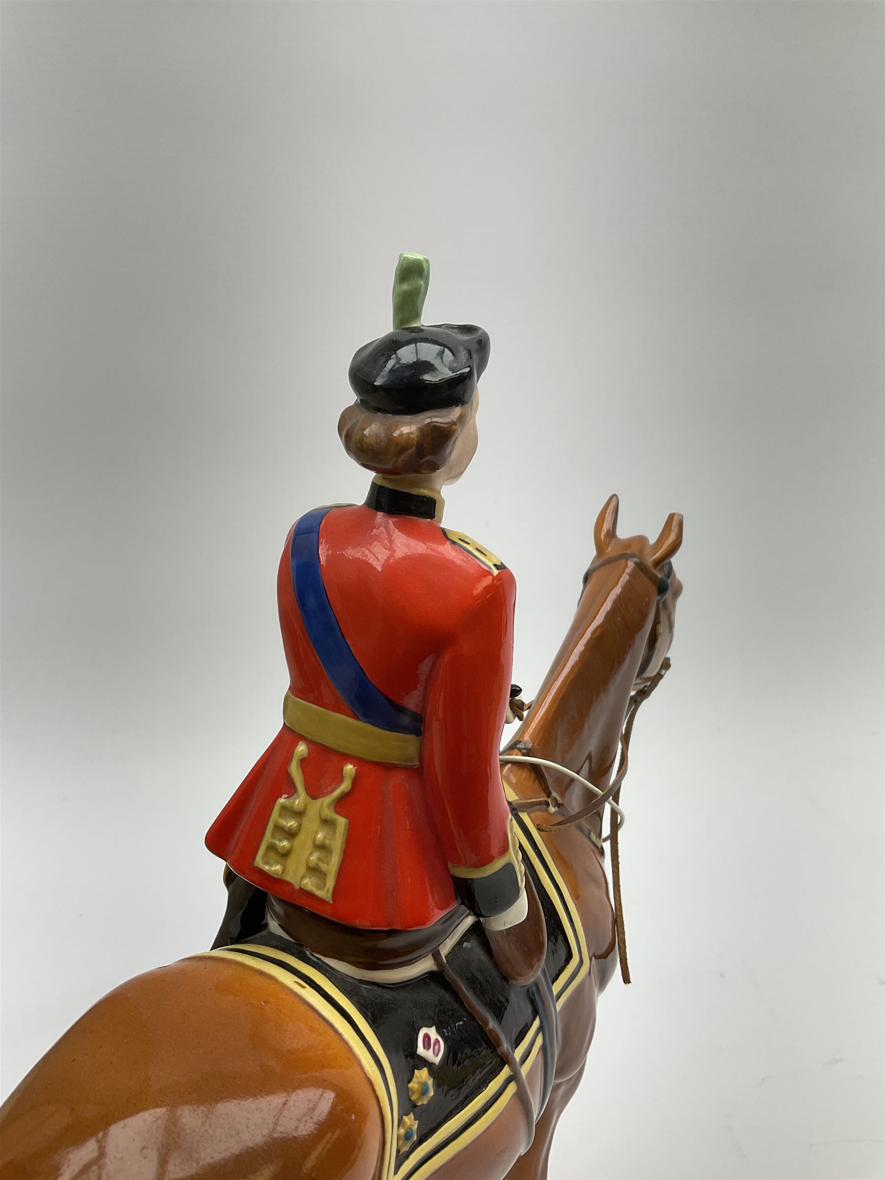A Beswick model of HM Queen Elizabeth II mounted on Imperial Trooping the colour 1957, model no 1546, H26.5cm.