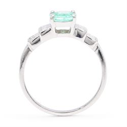 18ct white gold Paraiba tourmaline and diamond ring, single oval cut tourmaline of approx 0.90 carat, with six princess cut diamonds either side, in a stepped design setting, hallmarked, total diamond weight approx 0.35 carat