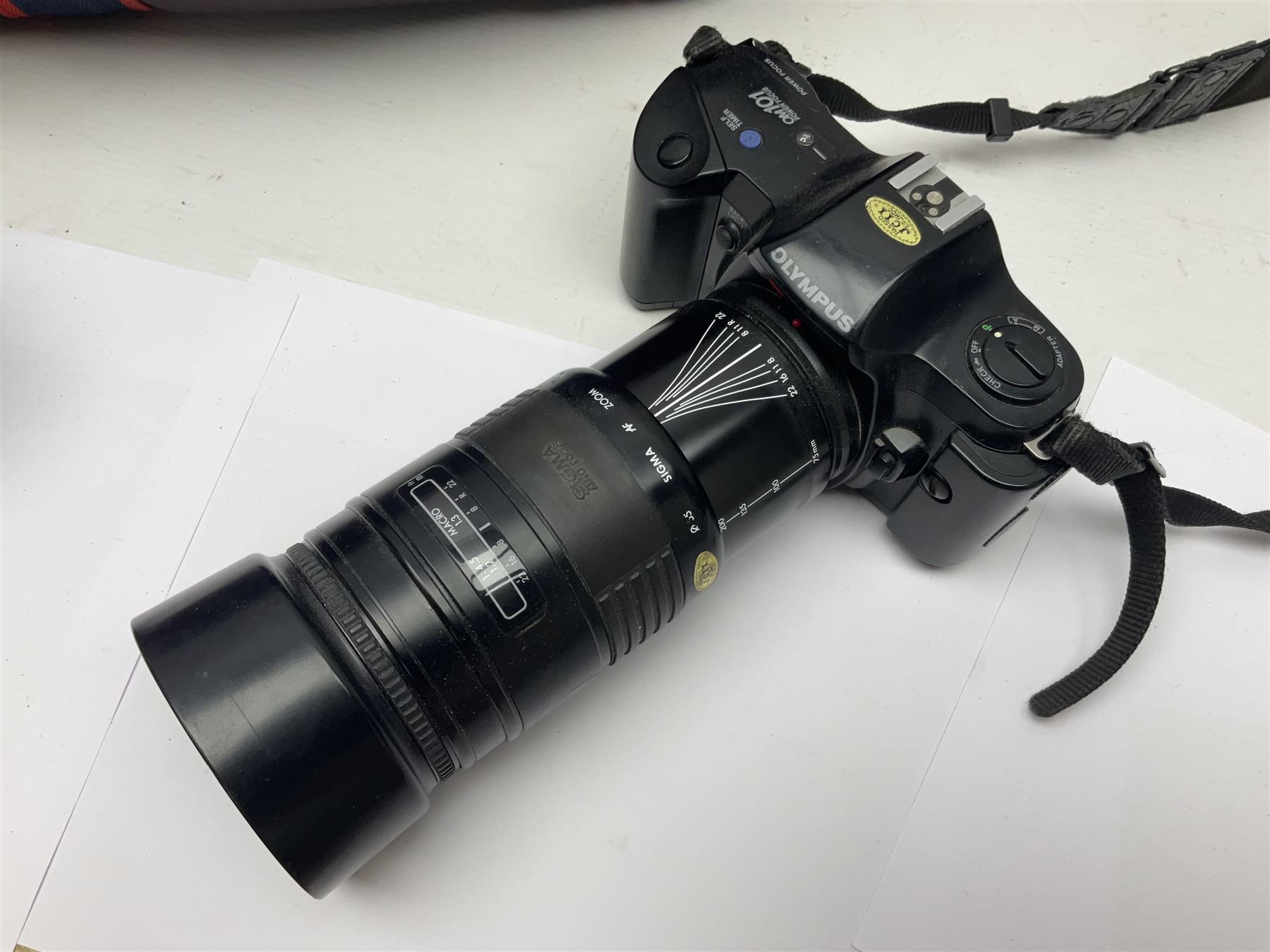 Cameras and accessories, to include Olympus OM101 Power Focus camera body, serial no 1076067, with 'Sigma AF Zoom 1:38, f=75 200mm' lens, serial no 2053714, Canon EOS 5000 camera body, serial no 1507812, with 'Canon Zoom EF 80-200mm, 1:4.5-5.6' lens, other cameras, by Miranda, Coronet and Ricoh and a collection of lenses, carry cases, etc 