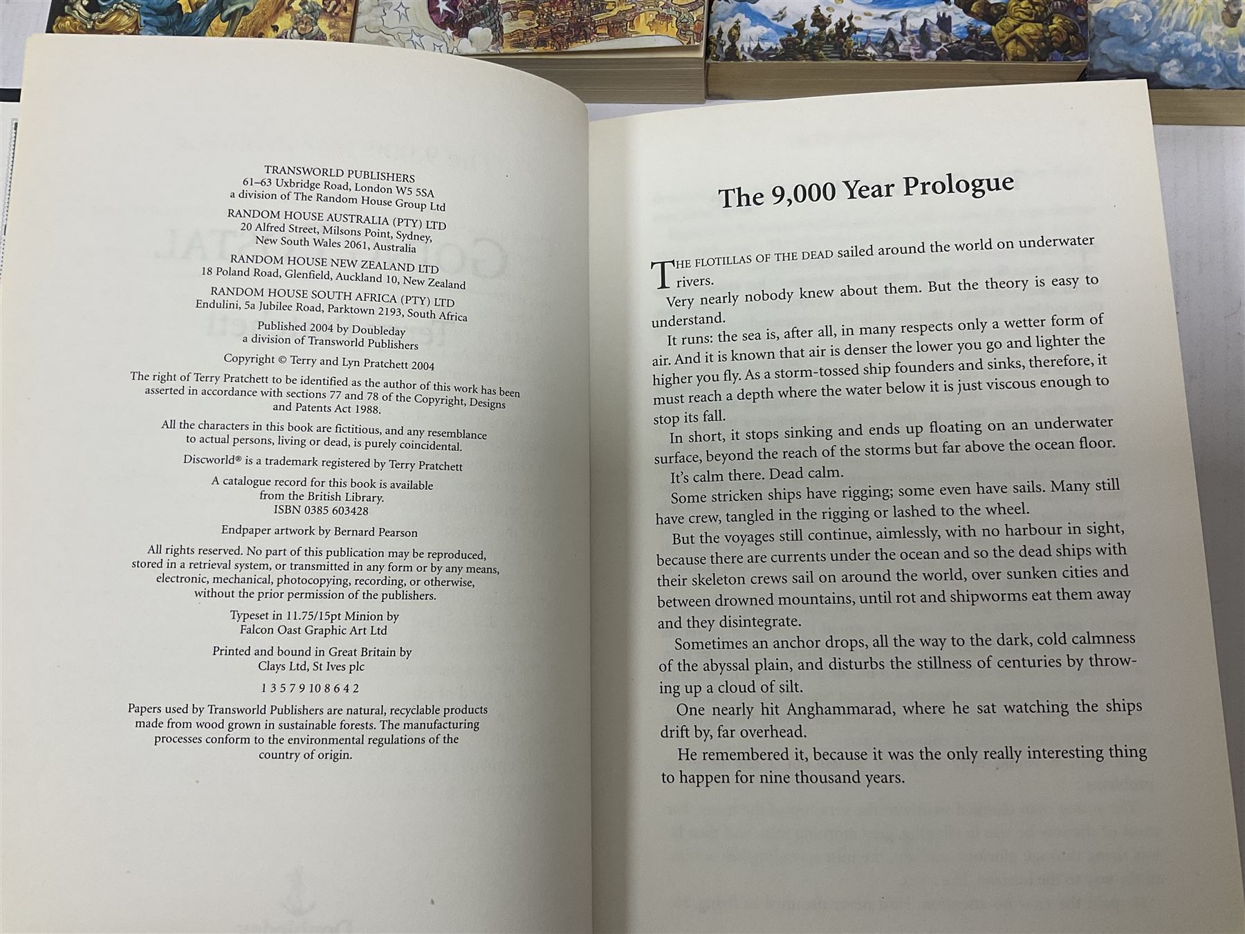 Collection of books by Terry Pratchett, of mostly Discworld interest, to include hardback edition of Going Postal, and further books such as Men at Arms, Sourcery, Small Gods etc 