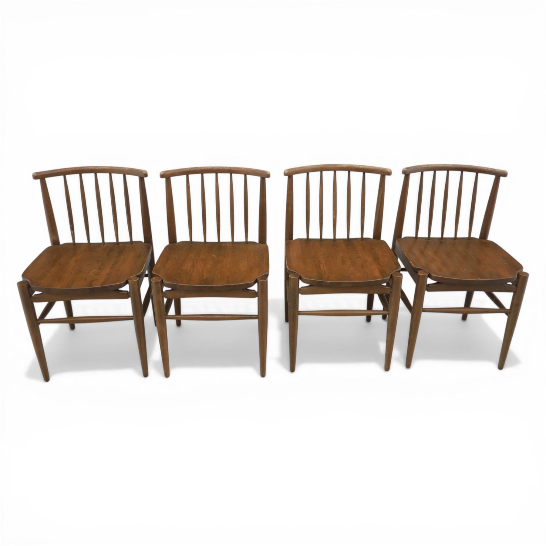Ensign - Mid-20th century elm extending dining table, with fold out leaf, bow ends and sides; and four low stick back chairs, labelled Ensign Bristow & Townsend Ltd, extended 168cm